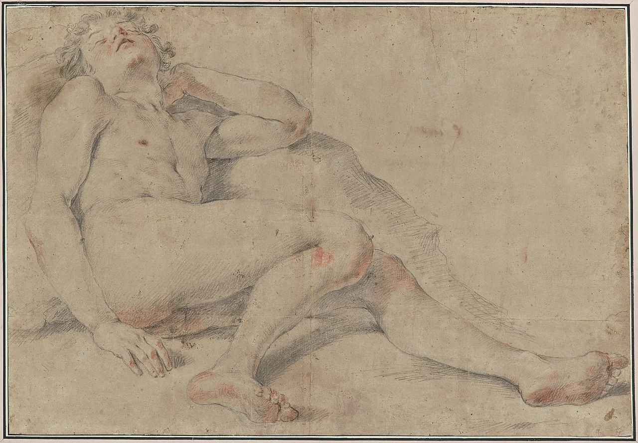 Giovane nudo sdraiato